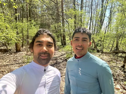 Remap's two founders in cycling kit on a woodland trail